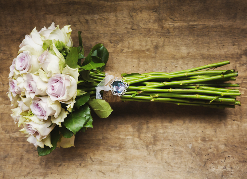 A wedding bouquet, a flower arrangement of long stemmed pink roses.