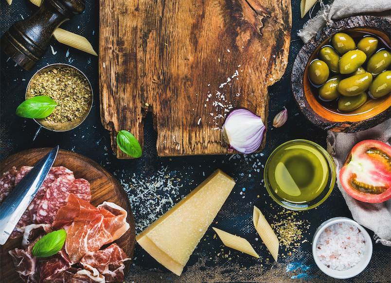Italian food cooking ingredients on dark background