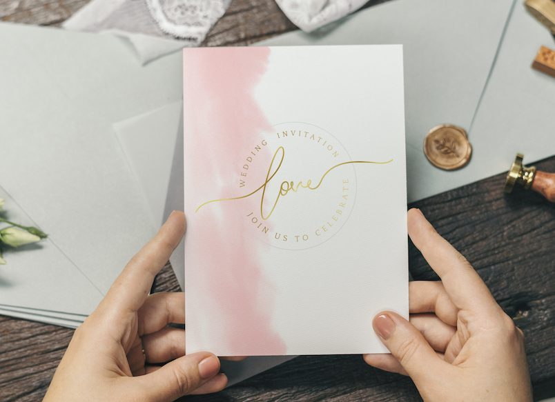 Woman with a wedding invitation card mockup